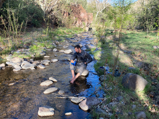 Filtering water on a backpacking trip